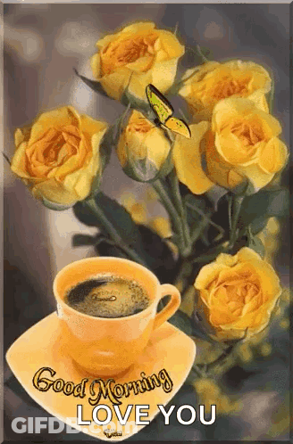 A Cup Of Coffee Is On A Saucer Next To A Bunch Of Yellow Roses . GIF