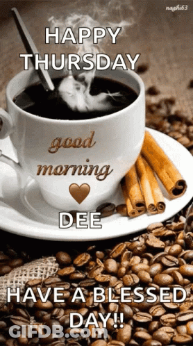 A Cup Of Coffee Is On A Saucer With Coffee Beans And Cinnamon Sticks GIF