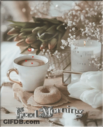 A Cup Of Coffee Next To A Donut And A Candle With The Words Good Morning GIF