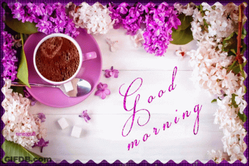 A Cup Of Coffee On A Saucer With Purple Flowers And The Words Good Morning Written On It GIF