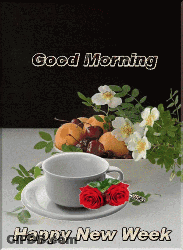 A Cup Of Coffee Sits On A Saucer Next To A Bowl Of Cherries GIF