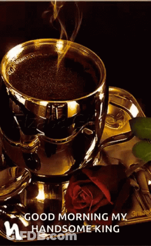 A Cup Of Coffee Sits On A Saucer Next To A Rose GIF