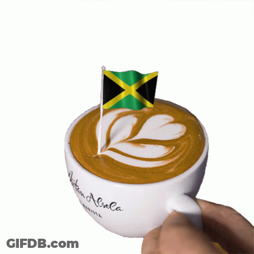 A Cup Of Coffee With A Small Jamaican Flag On Top Of It GIF