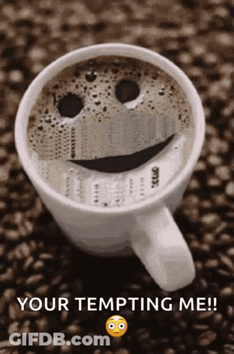 A Cup Of Coffee With A Smiley Face On It And The Words Your Tempting Me GIF