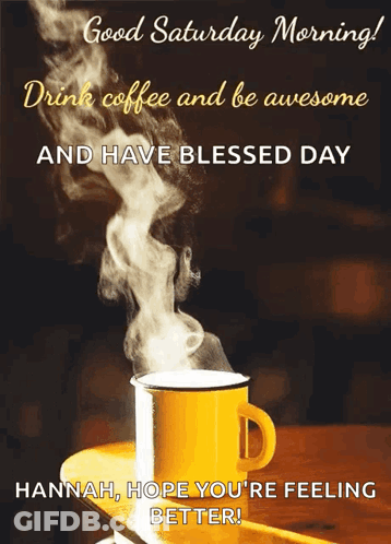 A Cup Of Coffee With Steam Coming Out Of It Is On A Table . GIF