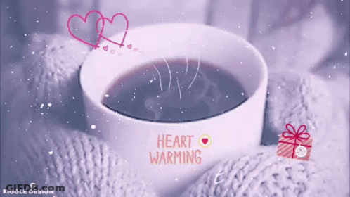 A Cup Of Coffee With The Words " Heart Warming " On It GIF