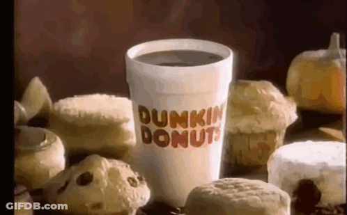 A Cup Of Dunkin Donuts Coffee Surrounded By Donuts And Muffins GIF
