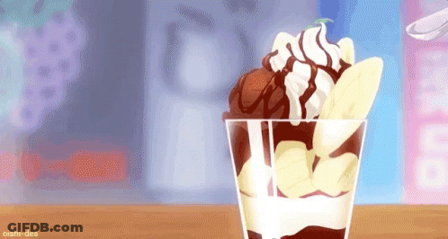 A Cup Of Ice Cream With Whipped Cream , Banana Slices And Chocolate Sauce On A Table . GIF