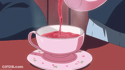 A Cup Of Tea Is Being Poured From A Teapot Into A Cup GIF