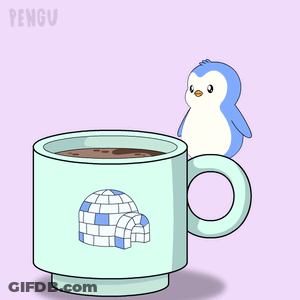 A Cup With An Igloo On It Is Filled With A Brown Liquid GIF