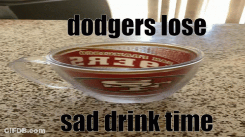 A Cup With The Word Dodgers On It Sits On A Counter GIF