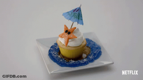 A Cupcake With A Starfish And An Umbrella On Top Of It On A White Plate With Netflix Written On The Bottom GIF