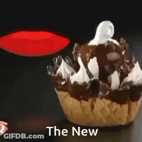 A Cupcake With Chocolate Sauce And Whipped Cream With The Words The New Above It GIF