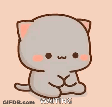A Cute Cartoon Cat Is Sitting Down And Waiting For Something . GIF