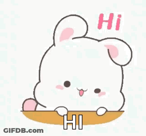 A Cute Cartoon Rabbit Is Sitting On A Table And Saying Hi . GIF