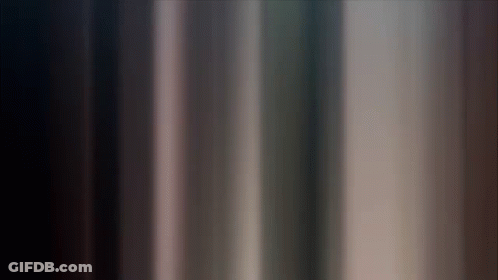 A Dark Background With A Few Lines Of Light Coming Out Of It GIF