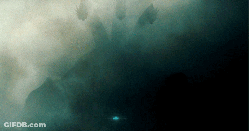 A Dark Background With A Few Trees In The Background GIF