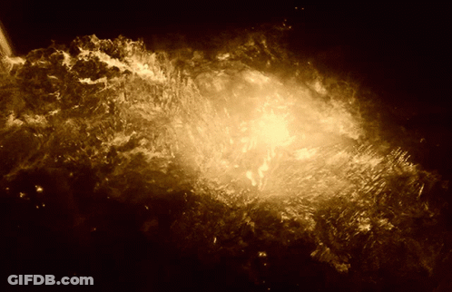 A Dark Background With A Glowing Object In The Center GIF