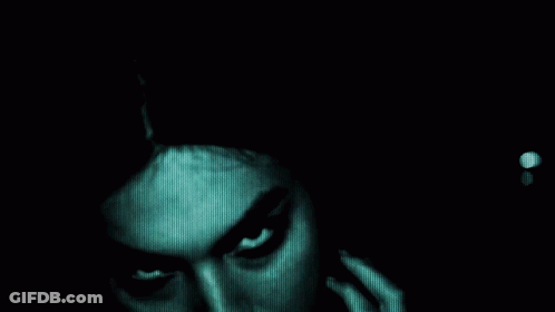 A Dark Background With A Light Coming Out Of The Middle GIF