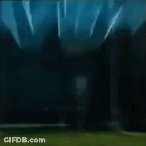 A Dark Background With A Light Shining Through It GIF