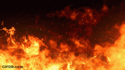 A Dark Background With A Lot Of Fire And Smoke Coming Out Of It GIF