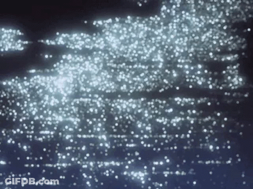 A Dark Background With A Lot Of White Sparkles On It GIF