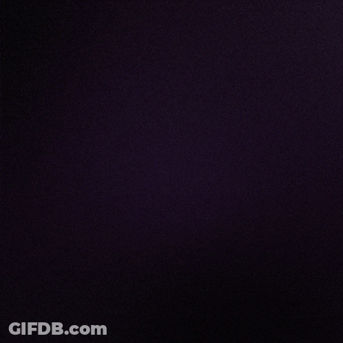A Dark Background With A Purple Glowing Object In The Center GIF