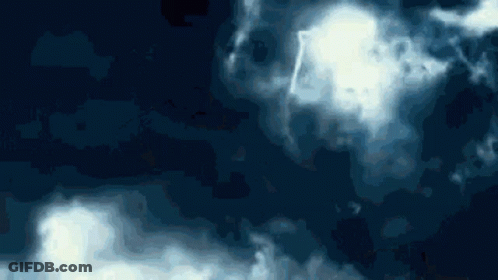 A Dark Blue Background With White Clouds Floating In It GIF