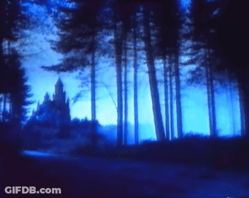 A Dark Blue Forest With A Castle In The Distance GIF