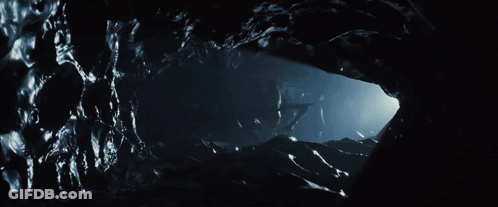 A Dark Cave With A Light Coming Out Of The Corner GIF