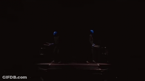 A Dark Room With A Blue Light Coming Out Of The Corner GIF