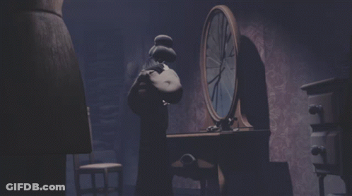 A Dark Room With A Clock In The Background GIF