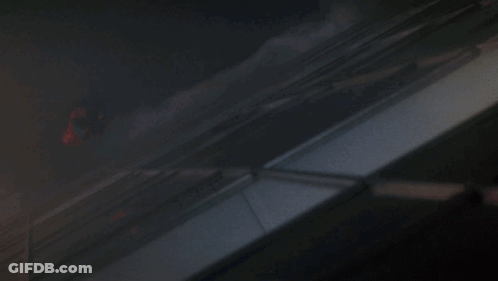 A Dark Room With A Few Spots Of Light On The Wall GIF