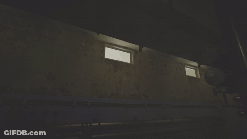 A Dark Room With A Few Windows And A Pipe GIF