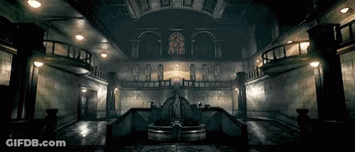 A Dark Room With A Fountain In The Middle GIF