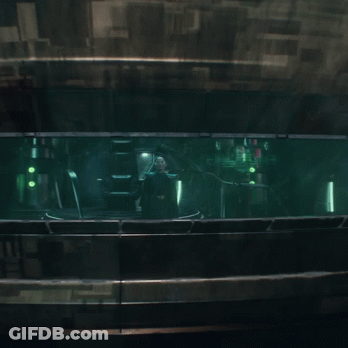 A Dark Room With A Green Light Coming Out Of The Window GIF