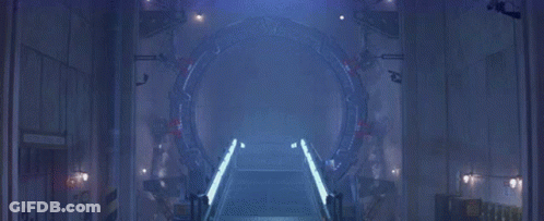 A Dark Room With A Light Coming Out Of A Hole In The Wall GIF