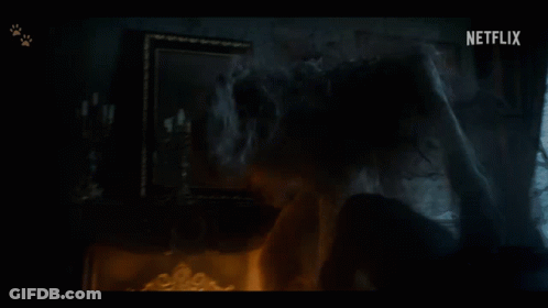A Dark Room With A Netflix Logo On The Bottom Left GIF