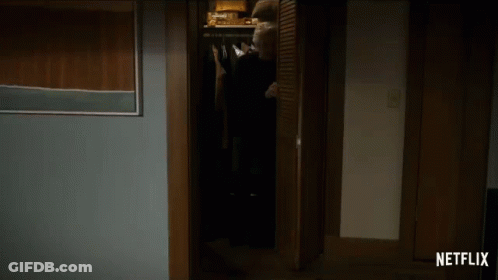 A Dark Room With A Netflix Logo On The Corner GIF