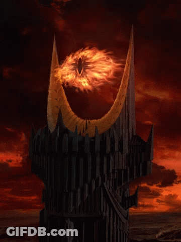 A Dark Tower With A Glowing Eye On Top GIF