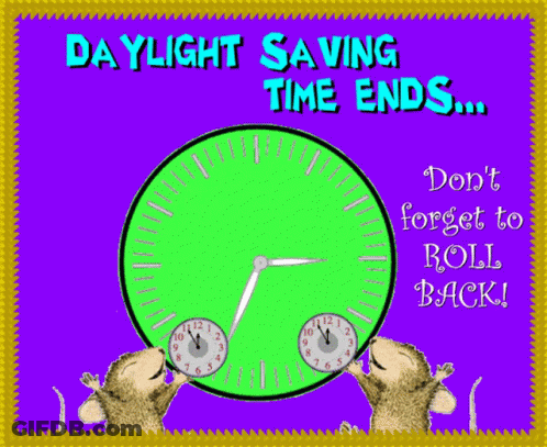 A Daylight Saving Time Ends Sign With Two Monkeys Holding A Clock GIF