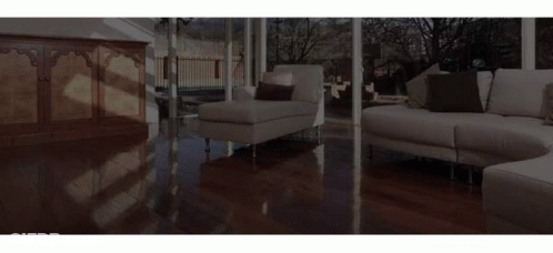 A Deck With A Couch And Two Chairs On It GIF
