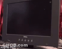 A Dell Computer Monitor Sitting On A Desk GIF