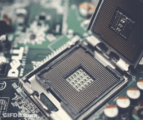 A Dell Computer Motherboard With A Cpu In It GIF