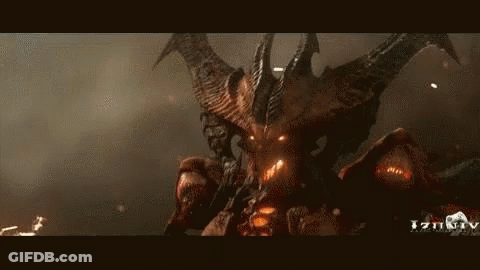 A Demon With Horns And Wings Is Standing In The Dark Looking At The Camera . GIF