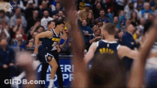 A Denver Basketball Player Celebrates With His Teammates During A Game GIF