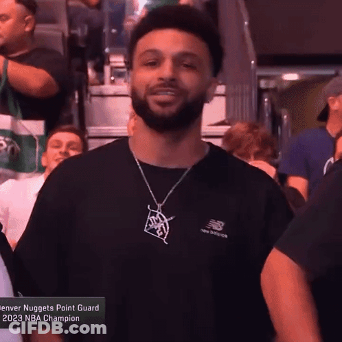 A Denver Nuggets Point Guard Is Wearing A Black Shirt GIF