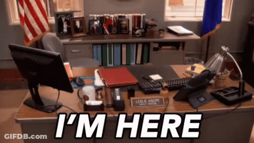 A Desk With A Computer And The Words I 'M Here On It GIF