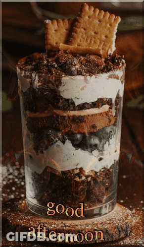 A Dessert In A Glass With The Words " Good Afternoon " On The Bottom GIF