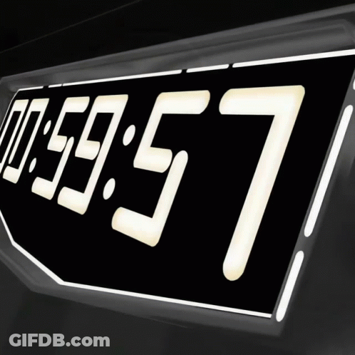 A Digital Clock Reads 00:59:57 On A Black Background GIF
